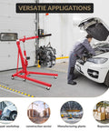 2 Ton Cherry Picker Engine Hoist Folds Flat To Save Bay Space Rolls Smooth On Six Heavy Duty Casters Includes Hand Pump For Garage Crew Auto Projects 4400 Lb in use lifting an engine in a garage.