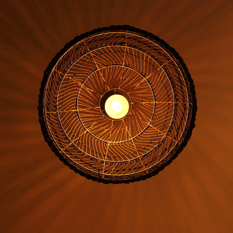 Bottom view of Bamboo Pendant Light Fixture Black Finish, Boho Rattan Woven Hanging Lamp For Kitchen Island Or Nursery lit up