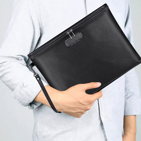 Person holding a Fireproof and Waterproof Document Bag with Lock for A4 Papers, Cash, Passport, Phone and Tablets, black color