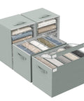 Four Pack Gray Closet Organizers And Storage Bins Heavy Duty Fabric Wardrobe Dividers with neatly folded clothes.