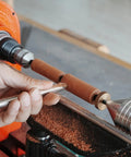 Pen Mandrel Kit For MT1 Morse Taper Woodturning Lathe in use, showing DIY pen project on benchtop lathe with wood shavings.