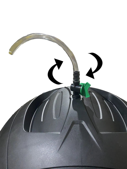 Close-up of Ms Tumbles 35 Gallon Compost Tumbler With Easy Turn System, showing drain hose with cut off valve on black and green lid.