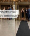 Black Carpet Floor Runner 2.6x30 Feet With Pre Attached Double Sided Tape for weddings and events at an indoor venue.