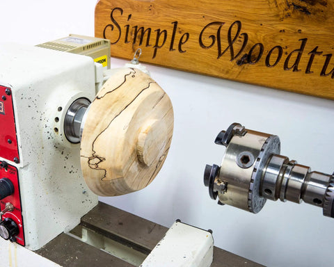 American Made Vacuum Chuck For Wood Turning Lathe With 1 Inch By 8 TPI Threads CNC Machined Aluminum holding a wooden bowl
