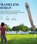 Man flying Massive 61ft Silver Soft Parafoil Beltfish Kite With Reel in park, demonstrating easy wind resistant design