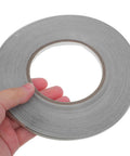Double Sided Conductive Tape For Electrical Repairs And EMI Shielding, 5mm wide silver conductive cloth roll held by hand
