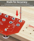 Close-up of a red 2 In 1 Shelf Pin And Hinge Jig For DIY Cabinets And Home Projects on wood, showing drill guide holes
