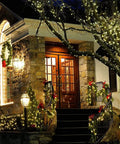 House adorned with 42.6 Foot Battery Powered Fairy Lights With 120 LEDs IP65 Waterproof Twinkle String With Timer And Eight Modes.