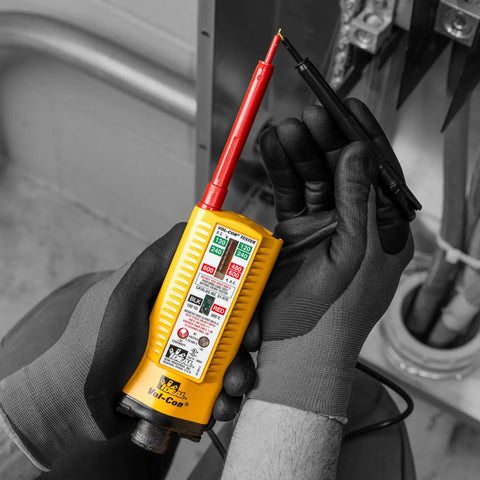 Technician holding Vol-Con Solenoid Voltage Tester With Vibration Alert, Continuity Function, AC DC Voltage Detection, CAT III 600V, Low Impedance Probes, Replaceable Leads, Live Wire Indicator, Durable Yellow Electric Tool For Pros