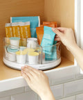 360 Degree Rotating Lazy Susan Organizer With 3 BPA Free Removable Clear Bins with snacks in kitchen cabinet