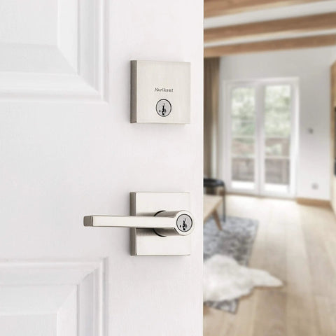 Halifax Keyed Entry Lever And Single Cylinder Deadbolt Combo With SmartKey Security In Satin Nickel For Exterior Doors Built Tough And Easy Install Backset And Thickness Guide Included on a white door