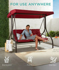 Three Seat Outdoor Canopy Swing Glider With Convertible Flatbed Patio Hammock in burgundy, porch and backyard setting