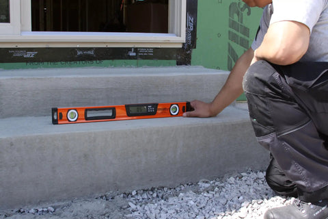 Person using Digital Box Level 24 Inch With High Accuracy Plus 0.1 Degree Readout, Orange Construction Tool For Carpentry And Masonry
