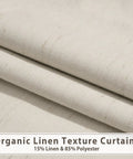 Close-up of 84-inch long white linen blackout curtains, 100 percent light blocking, showing texture and fabric composition.