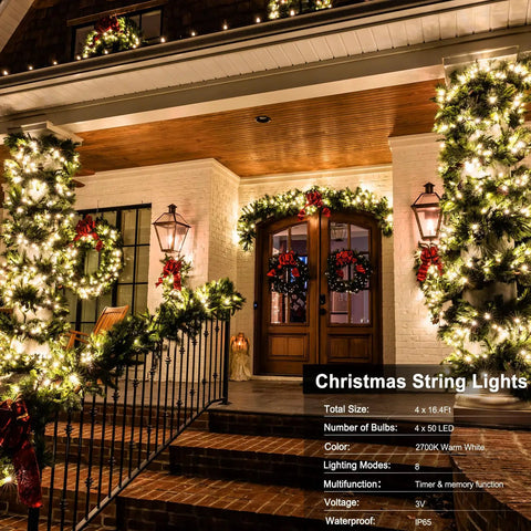 Decorated porch with 4 Pack Battery Operated Outdoor Christmas String Lights With 50 Warm White LEDs On 16.5 Feet Of Dark Green Cable Auto Timer For Yard Holiday Decoration And Wreaths glowing on garlands and wreaths.