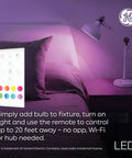 Color Changing LED Bulbs With Remote For BR30 Indoor Floodlights, 8.5W, mood lighting in a cozy dorm room setup with a lamp and remote