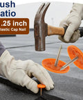 No Fuss Plastic Cap Nails Paired With Heavy Duty Electro Galvanized Ring Shank Fasteners And Resilient Orange Waterproof Washers For Fast Tar Paper And Roof Deck Work being installed with a hammer.