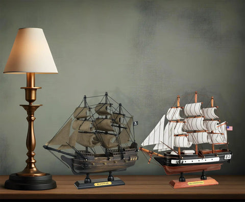 Handcrafted Wooden Model Ships Set Of Two Pirates And Warships Black Pearl And USS Constitution displayed on a shelf
