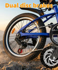 Rear wheel of Kids Mountain Bike 20 And 24 Inch For Boys And Girls Ages 7 To 12, 7 speed gear, dual disc brakes, blue bike on rocks