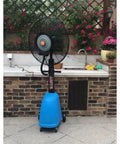 Badass Heavy Duty Industrial Misting Fan Crushes Summer Heat With High Velocity Airflow And Cold Water Fogging, blue base in garden.