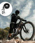 Mountain biker with 2 Pair Bike Pedal Straps For Universal Replacement Foot Pedal Straps With Toe Clips, outdoor setting.