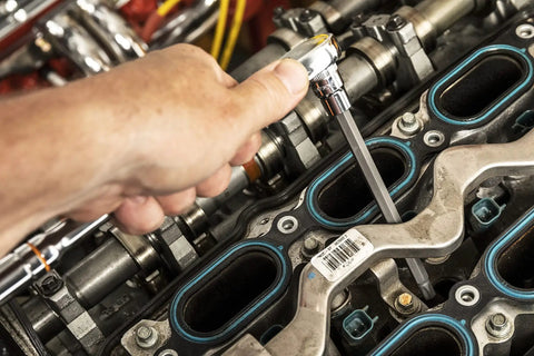 Mechanic using Beast 74 Piece Master Torx Bit Socket Set With External And Tamper Proof Torx Bits in engine repair