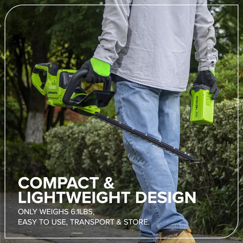Person holding 40V 26 Inch Brushless Hedge Trimmer Tool Only With Rotating Rear Handle, showcasing compact and lightweight design