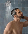 Man enjoying shower with Quattro Rain Showerhead With Four Modes Relieve Soothe Clarify Cleanse For Spa Like Shower Experience