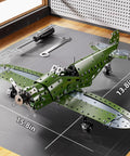 Metal Model Airplane Kit For Kids Ages 8 12, STEM Building Toy With 285 Parts And Tools displayed with dimensions on a workbench.