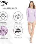 Woman wearing Womens UPF 50 Long Sleeve Rash Guard Swim Tee For Surf And Beach Peaceful Lilac Swimsuit Top with Quick Dry Fabric.