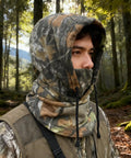 Hunter wearing Cold Weather Huntin Balaclava Face Mask With Camo Pattern, Windproof and Breathable Outdoor Sports Gear in forest