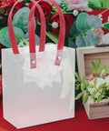 Lightweight Handheld Party Bags With Easy Handle Design 10 Pack Made of Clear PP Material Go to Gift Packaging surrounded by flowers