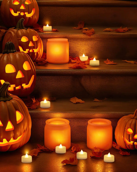 Halloween decor with jack-o'-lanterns and 24 Pack Flameless LED Tea Lights Battery Operated With Realistic Flicker For Votive Candles.