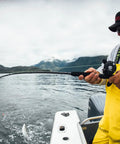 Rival Level Wind Conventional Fishing Reel Size 30 Packing Badass Heavy Graphite Frame And Corrosion Resistant Brass Gears in use on a fishing trip.