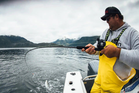 Rival Level Wind Conventional Fishing Reel Size 30 Packing Badass Heavy Graphite Frame And Corrosion Resistant Brass Gears in use on a fishing trip.