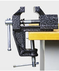 2 In 1 Mini Bench Vise And Hook Sharpener For Diyers, Portable Jeweler Table Clamp attached to a wooden workbench