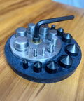 Round Disc Cutter Set With Ten Hardened Steel Punches And Dies Rubber Base Circle Cutter For Jewelry Making on wooden table