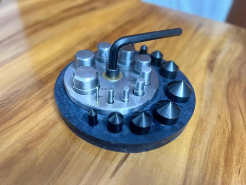 Round Disc Cutter Set With Ten Hardened Steel Punches And Dies Rubber Base Circle Cutter For Jewelry Making on wooden table
