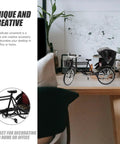 Absolutely Sweet Mini Motorcycle And Vintage Rickshaw Cake Topper With Detailed Metal Alloy Body on a desk with plants.