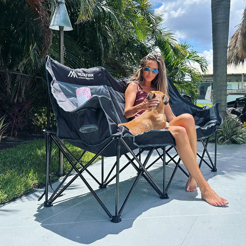 Woman sitting on Three Person Folding Camping Chair Couch With Padded Comfort Oversized Outdoor Loveseat Heavy Duty Frame