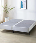 Dead Simple 9 Inch Box Spring With Built Tough Steel Core And Pristine White Cover Ultimate Mattress Foundation For Split California King Beds That Opens In A Flash on a wooden floor.