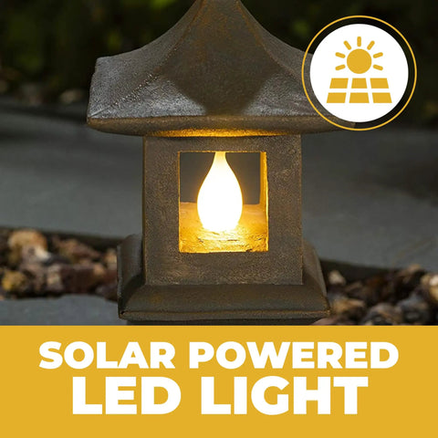 Solar Powered Pagoda Garden Statue With Flickering LED Lantern showcasing glowing light for outdoor decor.