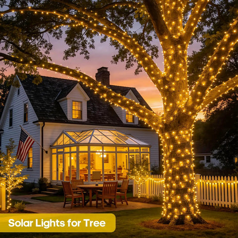 Illuminated tree and house with 2 Pack Solar String Lights Outdoor Waterproof 400 LED 151 Ft Total Warm White 8 Modes Solar Powered.
