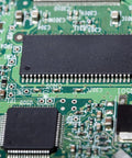 Close-up of a PCB with IC, representing 25Pcs DIP IC Socket Adapters 500V 2.54mm Pitch 16 Flat Pins For Breadboard And PCB Chip Upgrades.