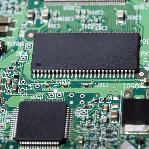 Close-up of a PCB with IC, representing 25Pcs DIP IC Socket Adapters 500V 2.54mm Pitch 16 Flat Pins For Breadboard And PCB Chip Upgrades.