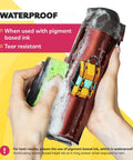 Hands cleaning a red bottle with backpack sticker using Ultra Clear Sticker Paper For Inkjet Printers 20 Sheets Transparent Glossy Printable Vinyl 8.5 By 11 Easy To Peel Strong Adhesive Backing For Bold Photos And Labels Smudge Free Durable DIY Friendly.