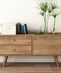 Wooden dresser with Antique Brass Cabinet Knobs Set, 6 Pack, showcasing sturdy hardware in a stylish home interior.
