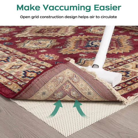 Vacuuming a patterned rug lifted to show Extra Thick Non Slip Rug Pad Gripper 2 by 3 Feet Keeps Area Rugs From Sliding On Hardwood Floors.