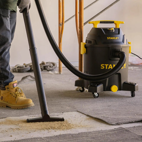 10 Gallon Wet Dry Shop Vacuum With 6 Peak HP Motor And Built In Drain used on workshop floor, emphasizing heavy duty suction.
