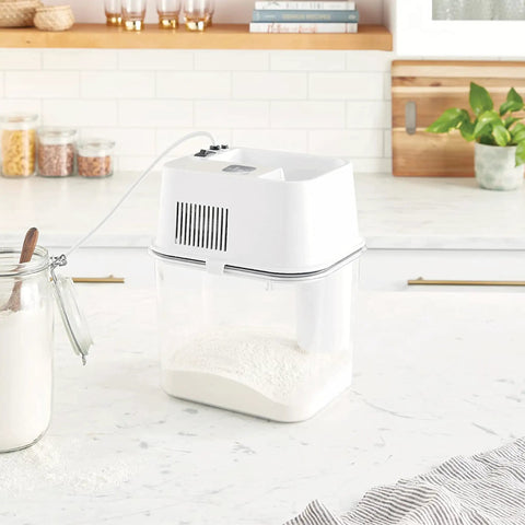 Electric Grain Mill For Home Use High Speed Wheat Corn Grain Grinder Flour Mill With See Through Milling Pan And Stainless Steel Chamber Assembled In The USA placed on kitchen countertop